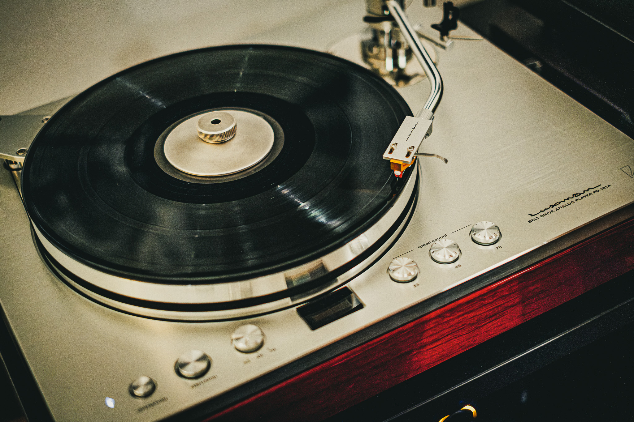 Luxman turntable playing a vinyl record